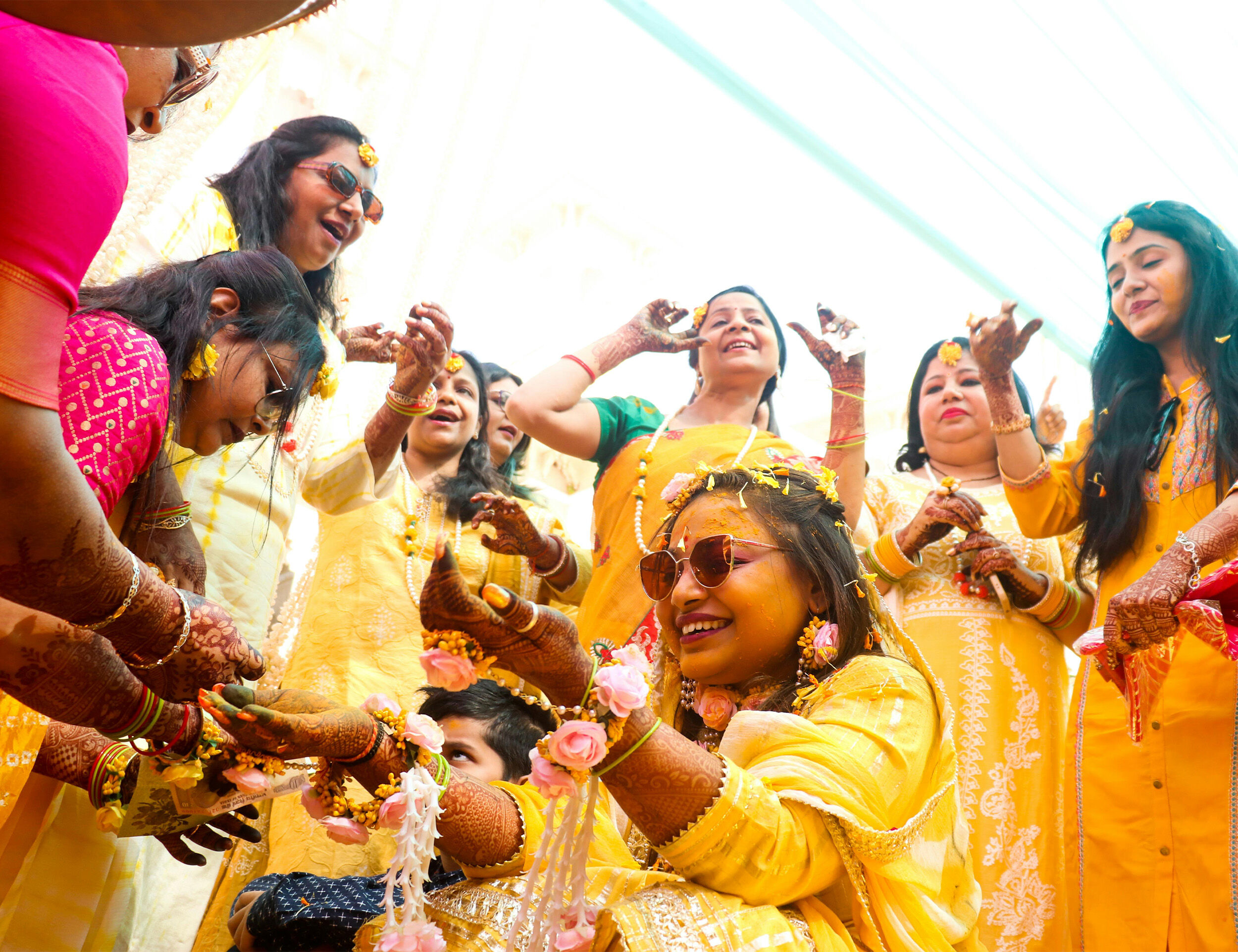 A bride and her family enjoying on her haldi ceremony